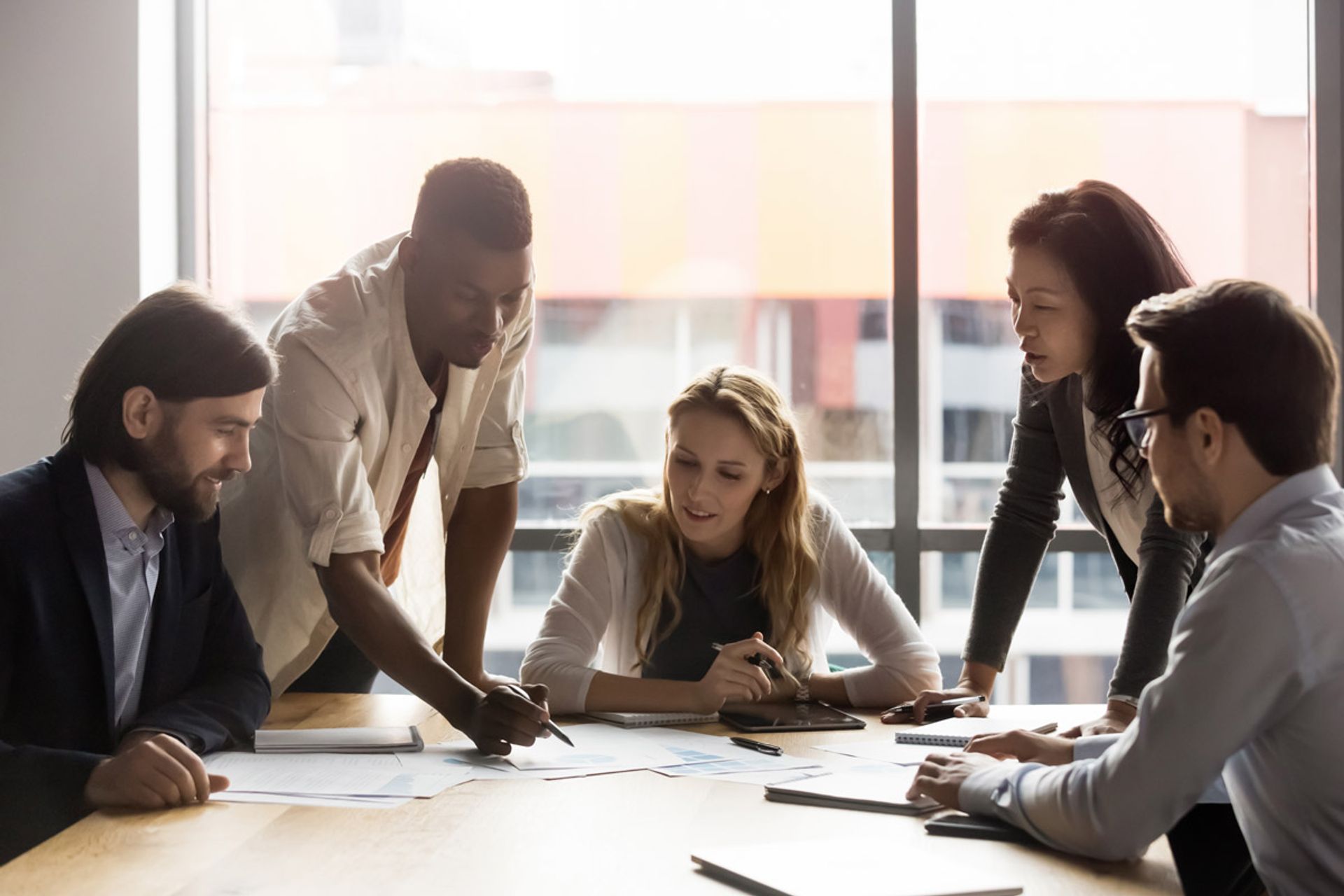 Team reviewing research in an office setting